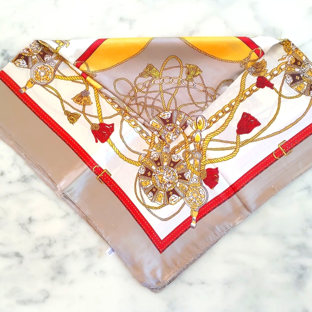NWT. MOSI Gold and tan silk scarf.